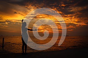 A female model silhouette controlling the movements of clouds on Ba Keo Beach