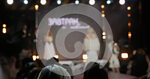 A female model walks down the runway during a fashion show at fashion week