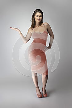 Female Model Wearing a Pink or Flesh Colored Dress