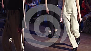 Female models walk the runway in different dresses during a Fashion Show. Fashion catwalk event showing new collection