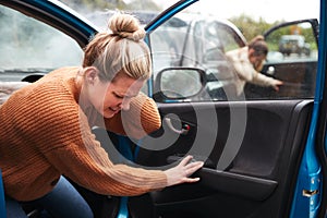 Female Motorist In Crash For Crash Insurance Fraud Getting Out Of Car