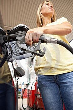 Female Motorist Filling Car With Diesel