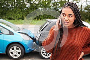 Female Motorist Involved In Car Accident Calling Insurance Company Or Recovery Service