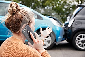 Female Motorist Involved In Car Accident Calling Insurance Company Or Recovery Service