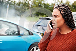 Female Motorist Involved In Car Accident Calling Insurance Company Or Recovery Service