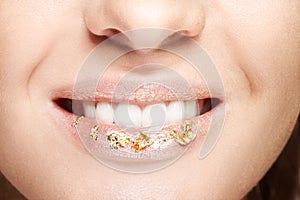 Female mouth with sparkles on lips. Closeup macro beauty portrai