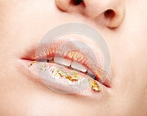 Female mouth with sparkles on lips. Closeup macro beauty portrai