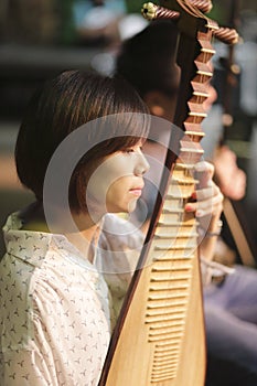 Female musician pipa accompaniment