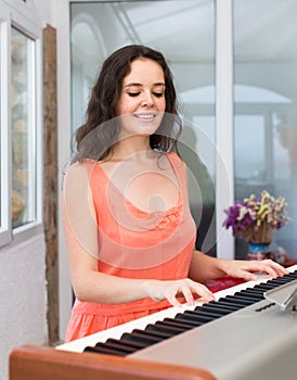 Female musician playing sequencer