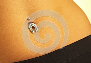 Female navel with piercing