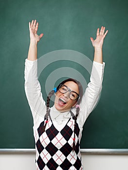 Female nerd with raised arms