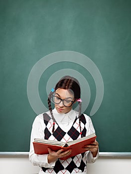 Female nerd reading book