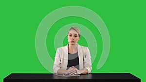 A female newsreader presenting the news, add your own text or image screen behind her on a Green Screen, Chroma Key.