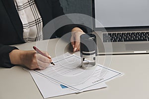 Female notary stamping agreement, company secretary, official document, validity photo