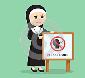 Female nun standing with please quiet sign