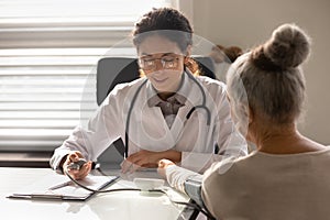 Female nurse examine mature patient at consultation