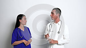 A Female Nurse Having a Happy Conversation With a Male Doctor