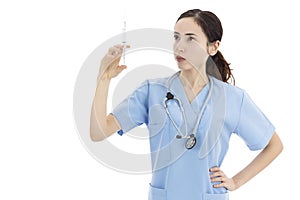 Female nurse holding a a syringe