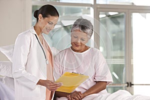 Female nurse performing checkup photo