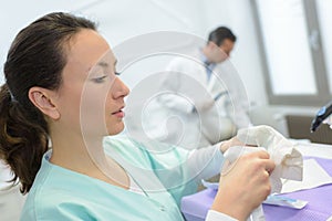 Female nurse preparing injection