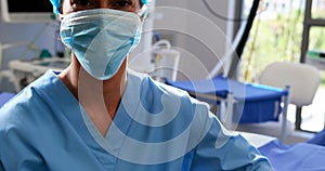 Female nurse in surgical mask at operation theater