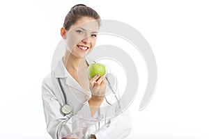 Female nutritionist holding a green apple