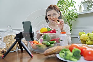 Female nutritionist telling her followers about healthy food, nutritional supplements