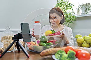 Female nutritionist telling her followers about healthy food, nutritional supplements