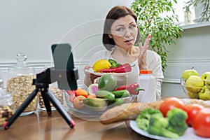 Female nutritionist telling her followers about healthy food, nutritional supplements