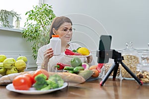 Female nutritionist telling her followers about healthy food, nutritional supplements