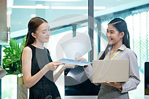 Female office person working with laptop meeting in workplace. Two businesswomen happy success connection corporate