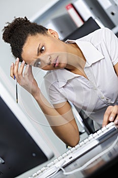 Female office worker having headache
