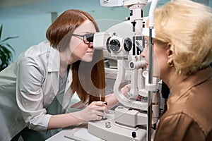 Female ophthalmologist uses modern equipment in her work