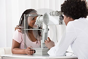 Female Optometrist Examining Patient