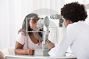 Female Optometrist Examining Patient