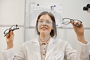 Female Optometrist Holding Glasses