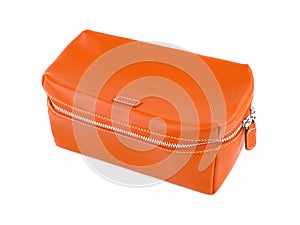Female orange leather cosmetic bag isolated on white