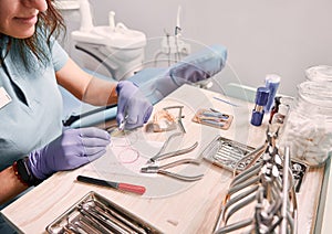 Female orthodontist working in dental office.