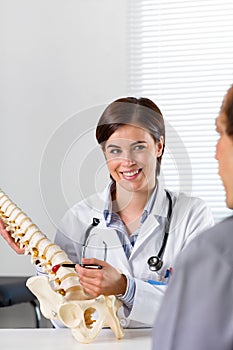 Female Orthopaedic surgeon explaining a back injury