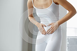 Female Pain. Closeup Beautiful Woman Body Feeling Stomach Pain