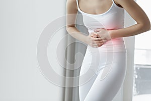 Female Pain. Closeup Beautiful Woman Body Feeling Stomach Pain