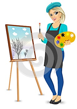 Female painter artist holding palette and brush