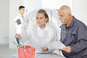 female painter learning to work