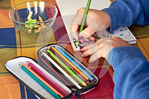 Female painting mandalas to combat stress caused by confinement to prevent coronavirus COVID-19