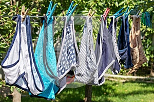 Female panties on clothespins rope. Drying clothes