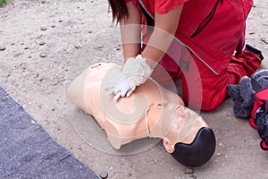 Female paramedic showing cardiopulmonary resuscitation - CPR on