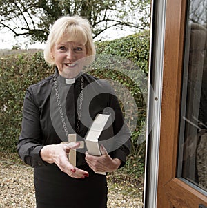 Female parish priest on a house call