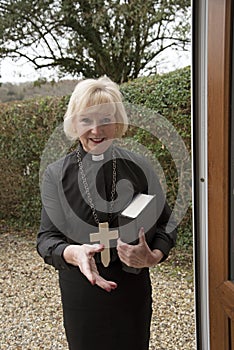 Female parish priest on a house call