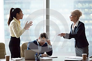 Female partners have disagreement over document at meeting photo