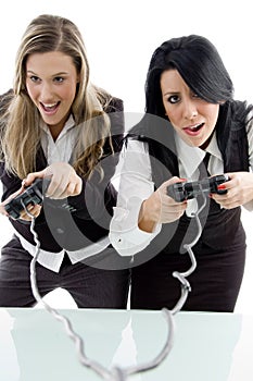 Female partners playing game and holding remote